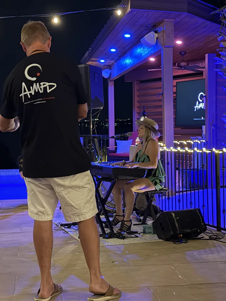 AMPD team member beside an outdoor performance